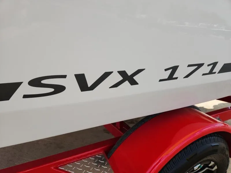 Slide: The Image of 2024 Starcraft SVX 171 OB boat on red trailer, close-up view. - 12