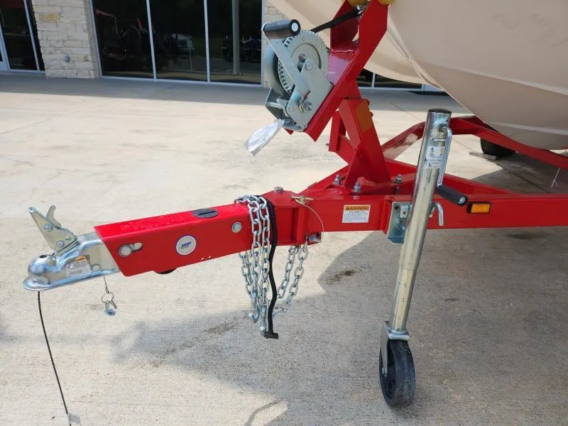 Slide: The Image of Trailer hitch of 2024 Starcraft SVX 171 OB boat, featuring red frame and safety chains. - 15
