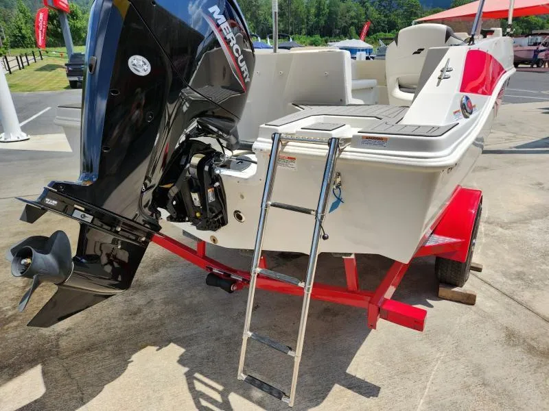 Slide: The Image of 2024 Starcraft SVX 171 OB boat with Mercury outboard motor and ladder on red trailer. - 5