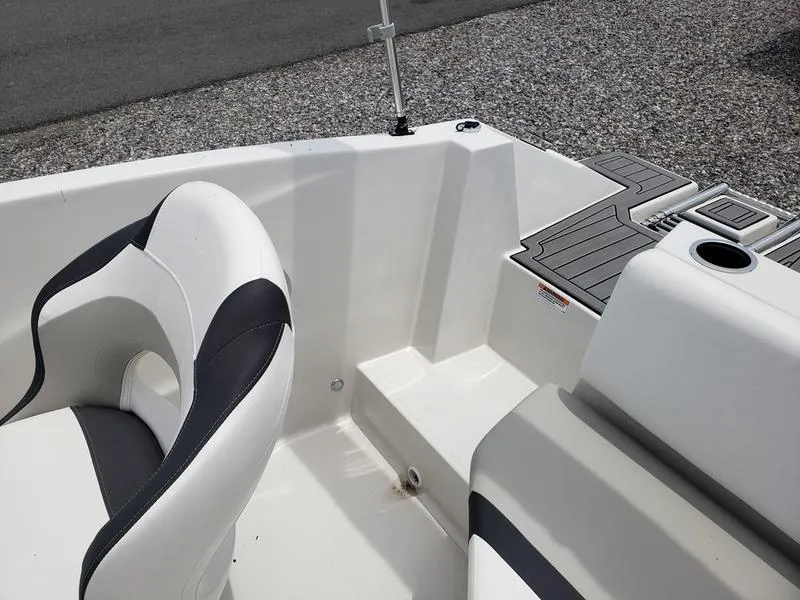 Slide: The Image of 2023 Starcraft SVX 171 OB boat interior with seating and deck details. - 11
