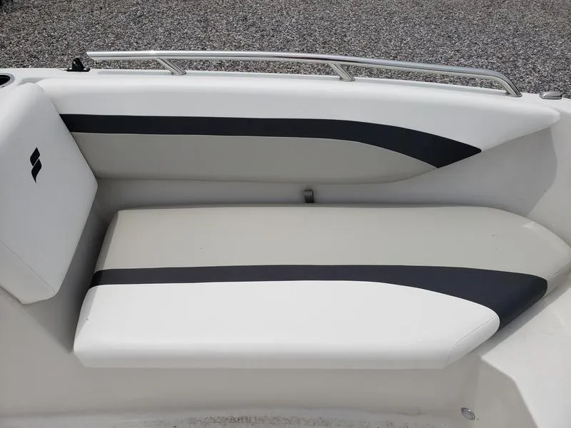 Slide: The Image of 2023 Starcraft SVX 171 OB boat seat with sleek black and white design. - 16