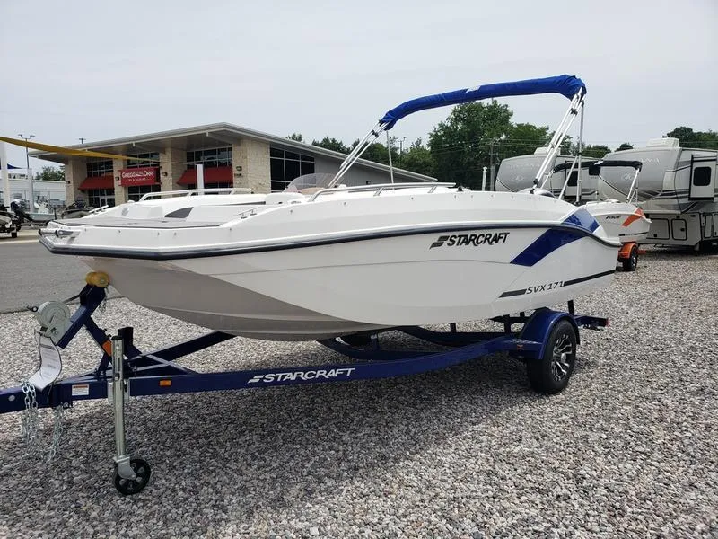 Slide: The Image of 2023 Starcraft SVX 171 OB boat on trailer, displayed outdoors. - 3