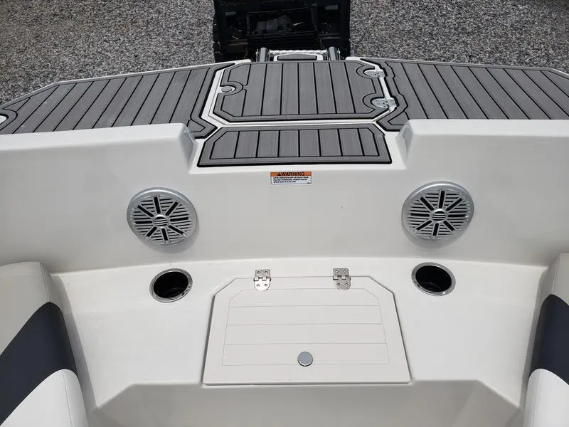 Slide: The Image of 2023 Starcraft SVX 171 OB boat deck with speakers and storage hatch. - 8