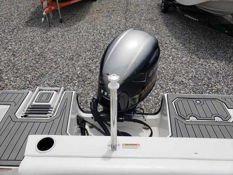 Slide: The Image of 2023 Starcraft SVX 171 OB boat with outboard motor on gravel surface. - 9