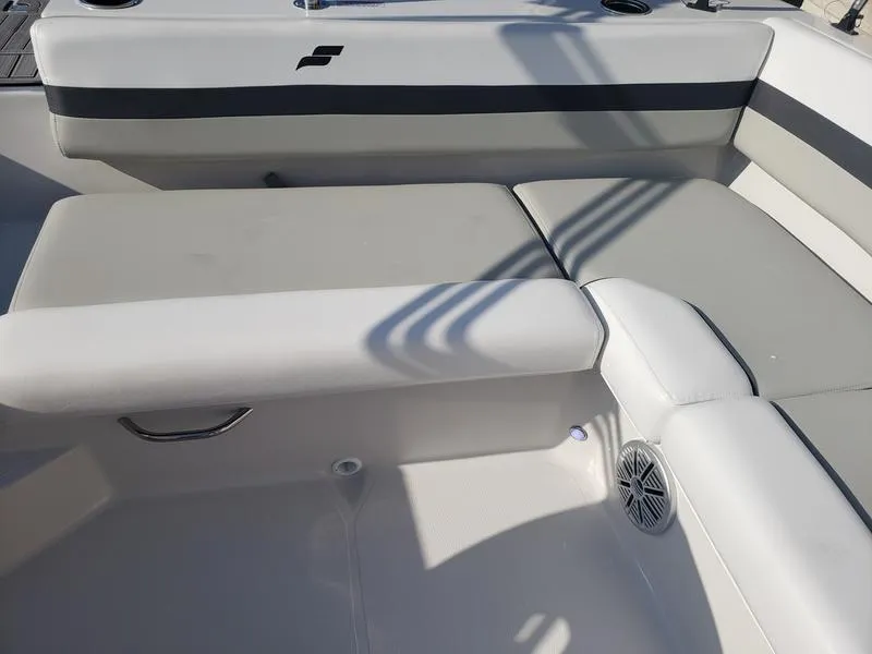 Slide: The Image of 2023 Starcraft SVX191OB boat interior with cushioned seating and speaker. - 13