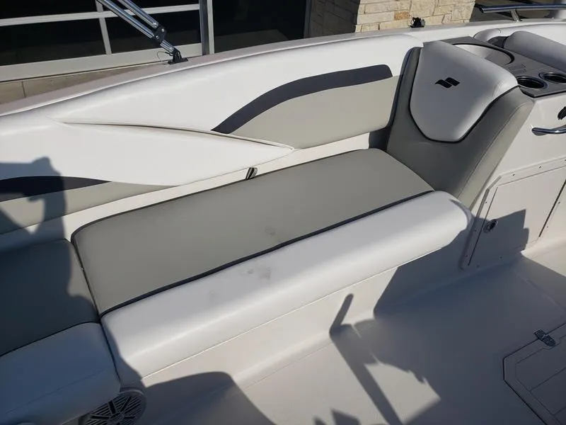 Slide: The Image of 2023 Starcraft SVX191OB boat interior with gray and white seating. - 15