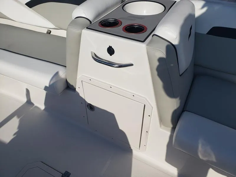 Slide: The Image of 2023 Starcraft SVX191OB boat interior with cup holders and storage compartment. - 20
