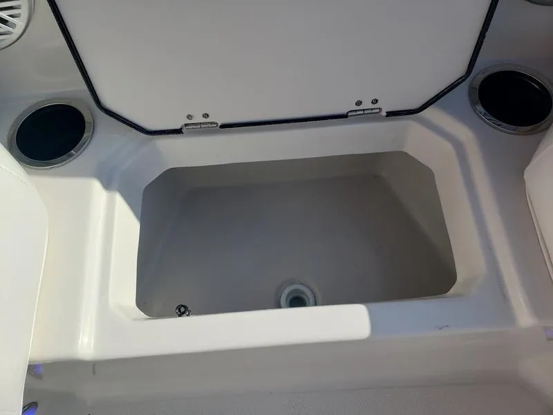 Slide: The Image of Open storage compartment on 2023 Starcraft SVX191OB boat. - 23