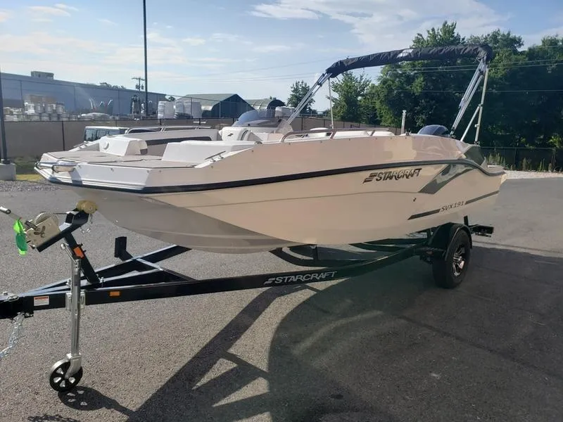 Slide: The Image of 2023 Starcraft SVX191OB boat on trailer, parked outdoors, sunny day. - 4