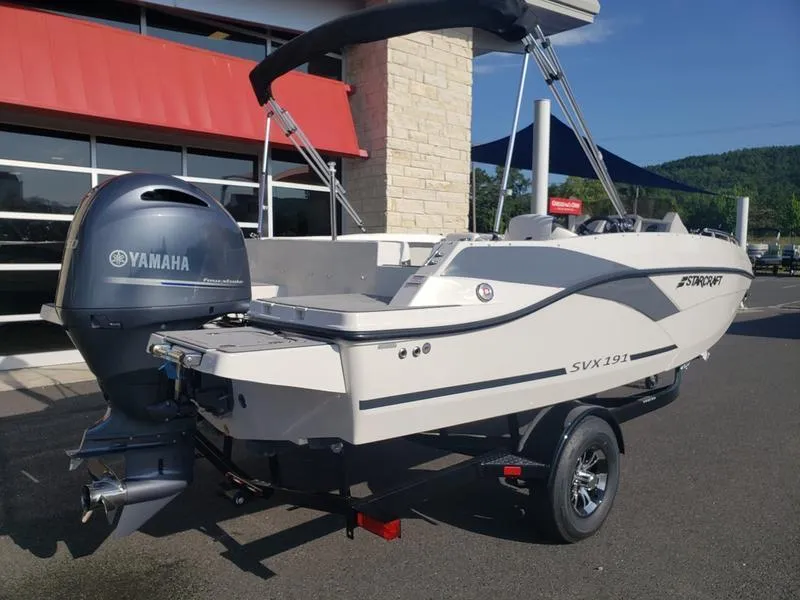 Slide: The Image of 2023 Starcraft SVX191OB boat with Yamaha engine, parked outdoors. - 7