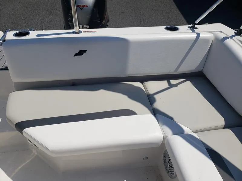 Slide: The Image of 2023 Starcraft SVX 171 OB boat interior with cushioned seating and cup holders. - 12