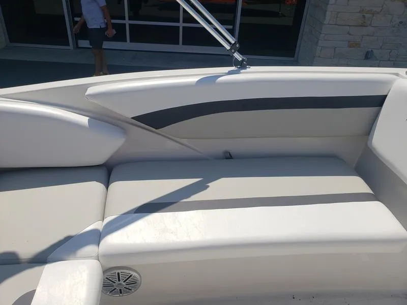 Slide: The Image of 2023 Starcraft SVX 171 OB boat interior with cushioned seating and speaker. - 13