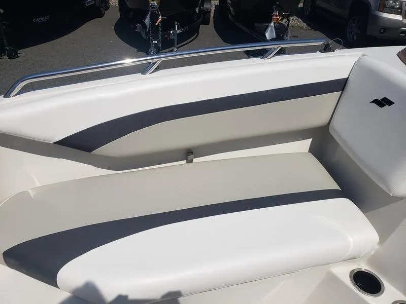 Slide: The Image of 2023 Starcraft SVX 171 OB boat interior with cushioned seating and sleek design. - 16