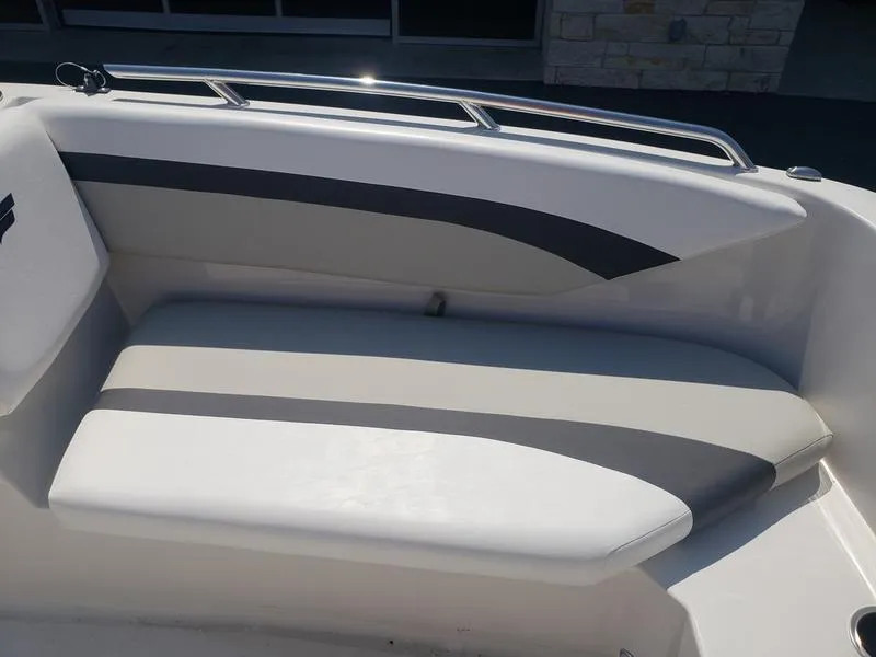 Slide: The Image of 2023 Starcraft SVX 171 OB boat interior seating with sleek design and comfortable cushions. - 17