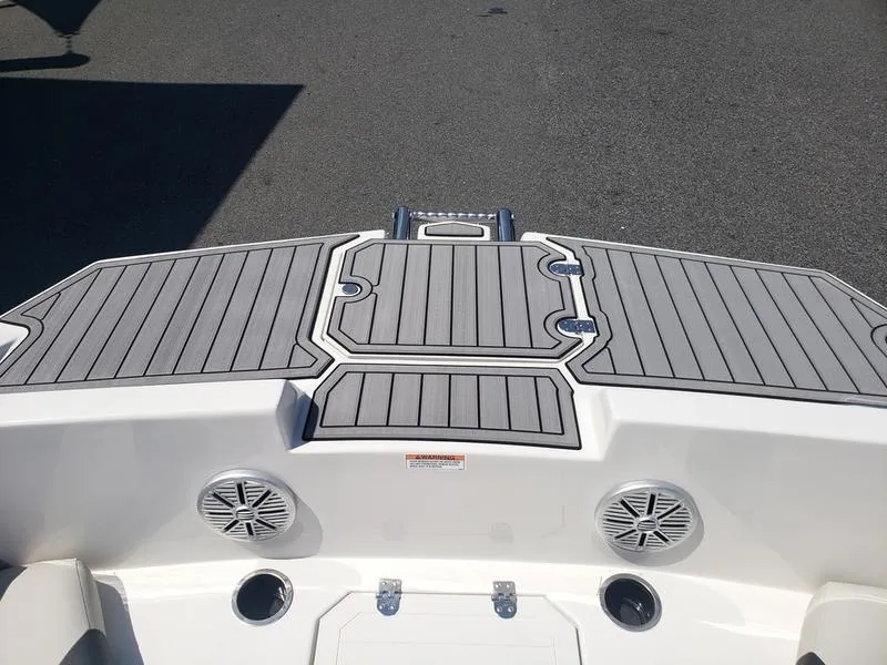 Slide: The Image of 2023 Starcraft SVX 171 OB boat deck with speakers and ladder. - 19