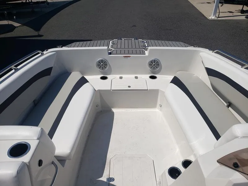 Slide: The Image of 2023 Starcraft SVX 171 OB boat interior with seating and cup holders. - 20