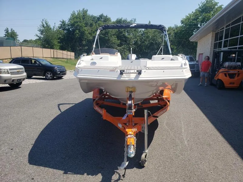 Slide: The Image of 2023 Starcraft SVX 171 OB boat on orange trailer in parking lot. - 4