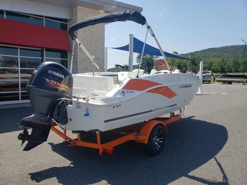 Slide: The Image of 2023 Starcraft SVX 171 OB boat with Yamaha engine on orange trailer, parked outdoors. - 6