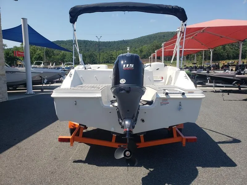 Slide: The Image of 2023 Starcraft SVX 171 OB boat with 115 HP engine on display outdoors. - 7