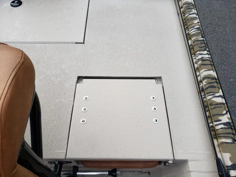 Slide: The Image of 2024 Avid Rogue 20 CC boat interior with beige seating and camouflage trim. - 10