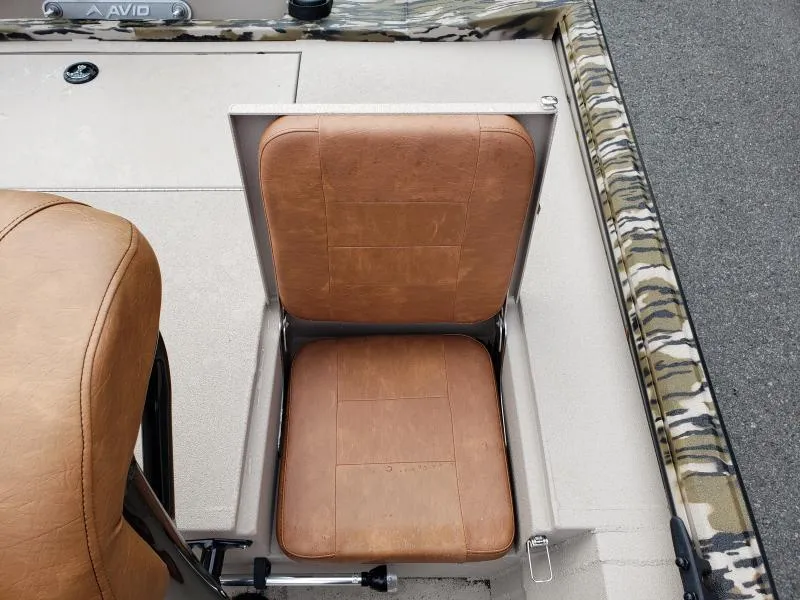 Slide: The Image of 2024 Avid Rogue 20 CC boat seat with camouflage trim and tan upholstery. - 11