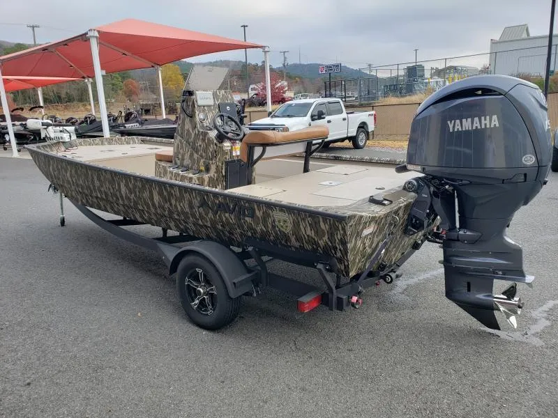 Slide: The Image of 2024 Avid Rogue 20 CC boat with Yamaha engine, parked outdoors. - 7