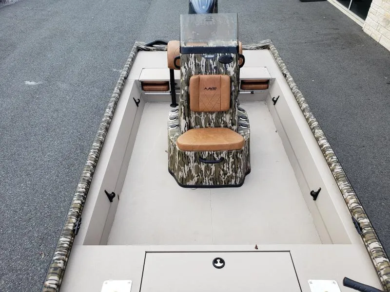 Slide: The Image of 2024 Avid Rogue 20 CC boat interior with camo design and central seating. - 9