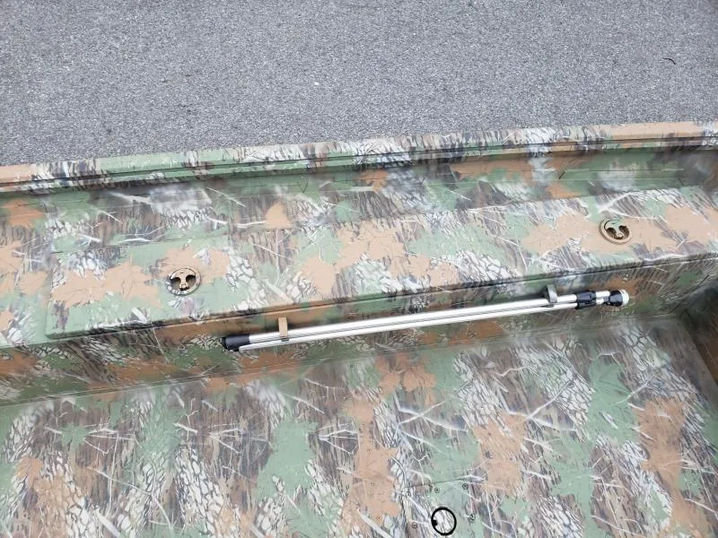 Slide: The Image of 2024 G3 Sportsman 1610 boat with camouflage interior design. - 13