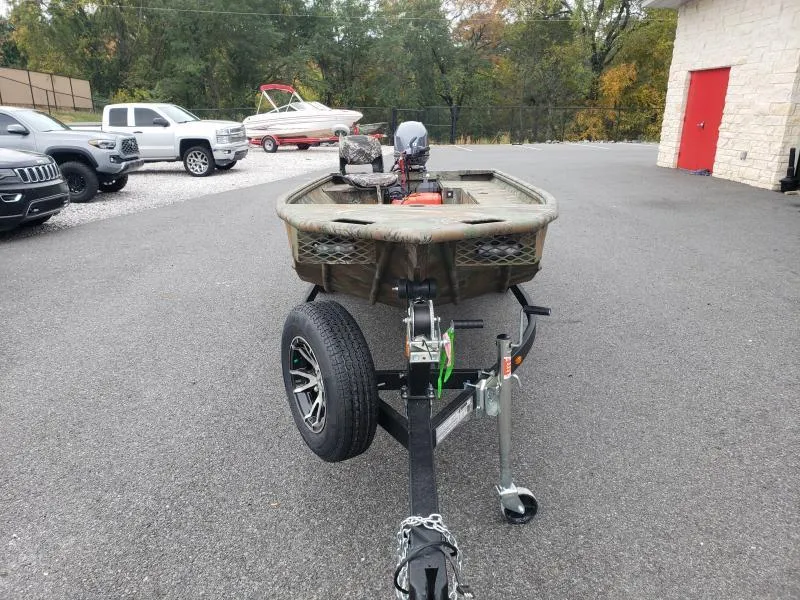 Slide: The Image of 2024 G3 Sportsman 1610 boat on trailer in parking lot. - 3