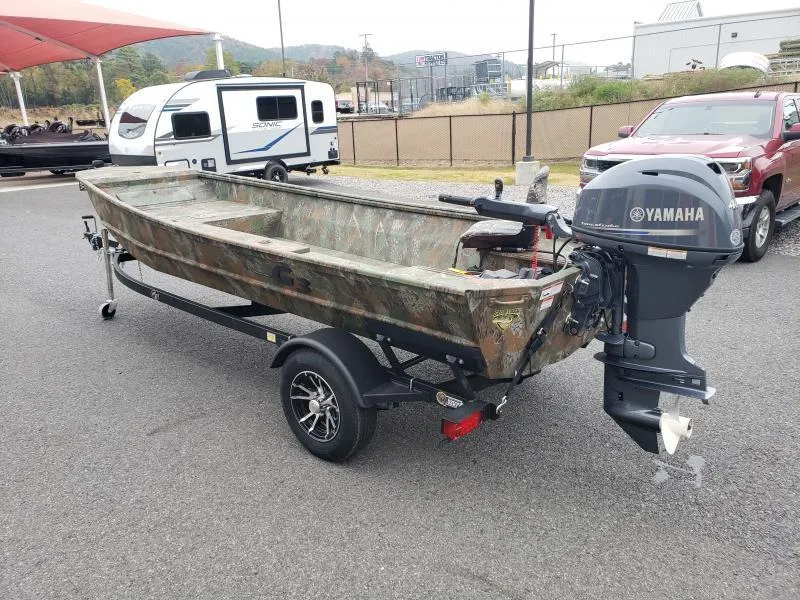 Slide: The Image of 2024 G3 Sportsman 1610 boat with Yamaha motor on trailer, parked outdoors. - 6