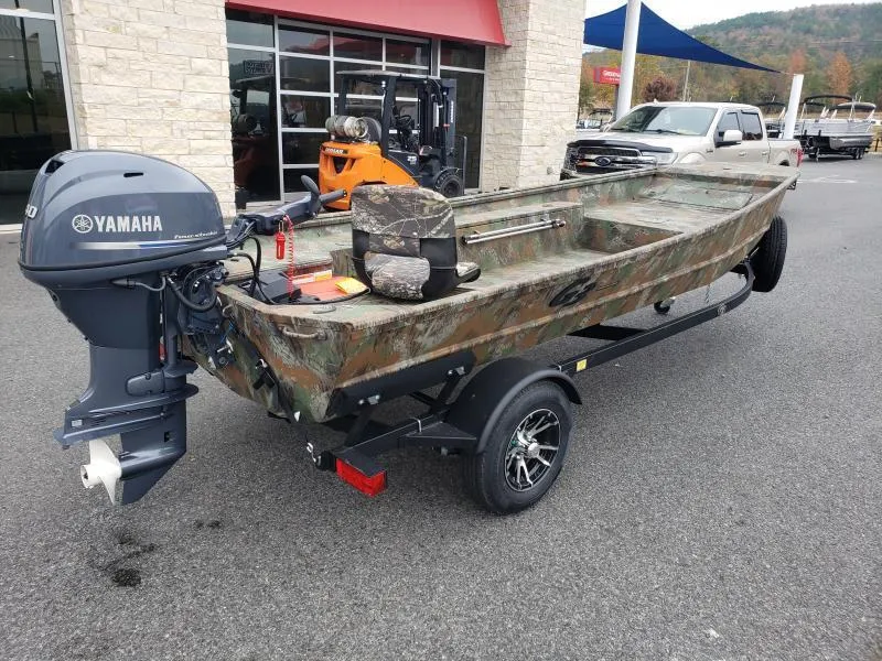 Slide: The Image of 2024 G3 Sportsman 1610 boat with Yamaha motor on trailer, parked outdoors. - 8