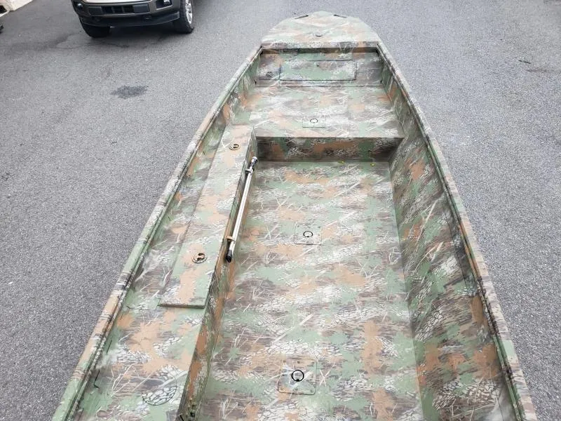Slide: The Image of 2024 G3 Sportsman 1610 boat with camouflage design on a paved surface. - 9