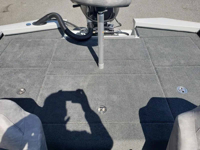 Slide: The Image of 2023 Avid 18XB boat deck with gray carpet and seating. - 12