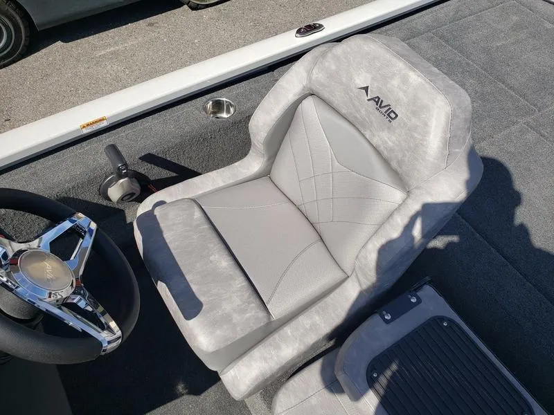 Slide: The Image of 2023 Avid 18XB boat seat with steering wheel, featuring modern design and comfort. - 14
