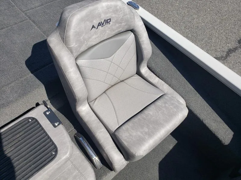 Slide: The Image of 2023 Avid 18XB boat seat with gray upholstery and modern design. - 16