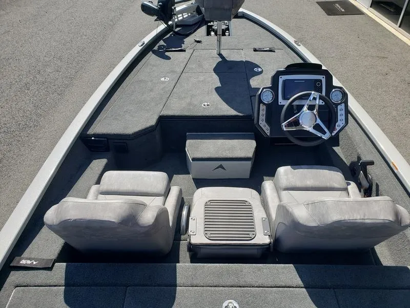 Slide: The Image of 2023 Avid 18XB boat interior with steering console and seating arrangement. - 21
