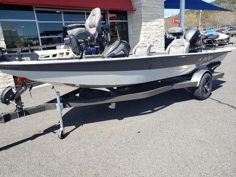 Slide: The Image of 2023 Avid 18XB boat on trailer, parked outside dealership. - 3