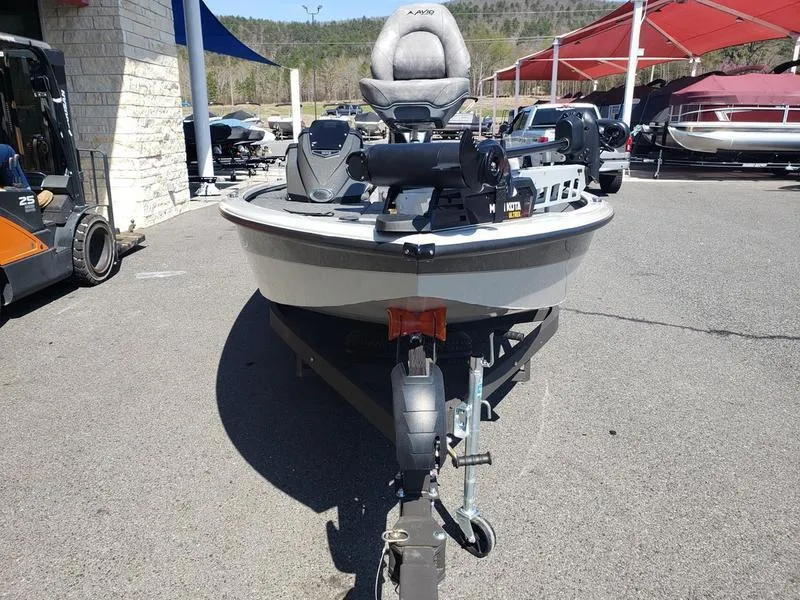 Slide: The Image of 2023 Avid 18XB boat on trailer, parked outdoors at a dealership. - 4