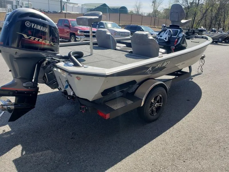 Slide: The Image of 2023 Avid 18XB boat with Yamaha motor on trailer, parked outdoors. - 5