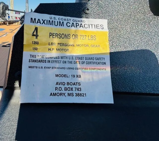 Slide: The Image of 2024 Avid 19XB boat capacity label, U.S. Coast Guard certified, 4 persons or 727 lbs. - 23