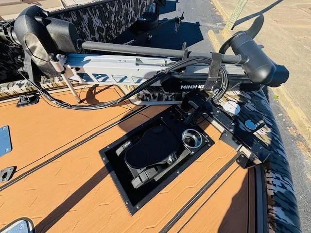 Slide: The Image of 2024 Avid 19XB boat with Minn Kota trolling motor on deck. - 8