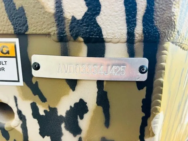 Slide: The Image of Camouflage-patterned Avid 16COM 2025 model with serial number plate. - 14