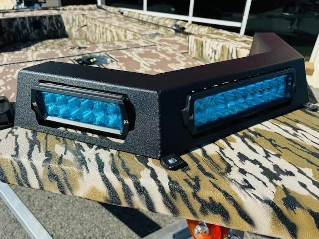 Slide: The Image of Avid 16COM 2025 boat with blue LED lights and camouflage pattern. - 4