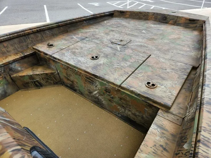 Slide: The Image of 2024 G3 17 SC boat interior with camouflage design and storage compartments. - 23