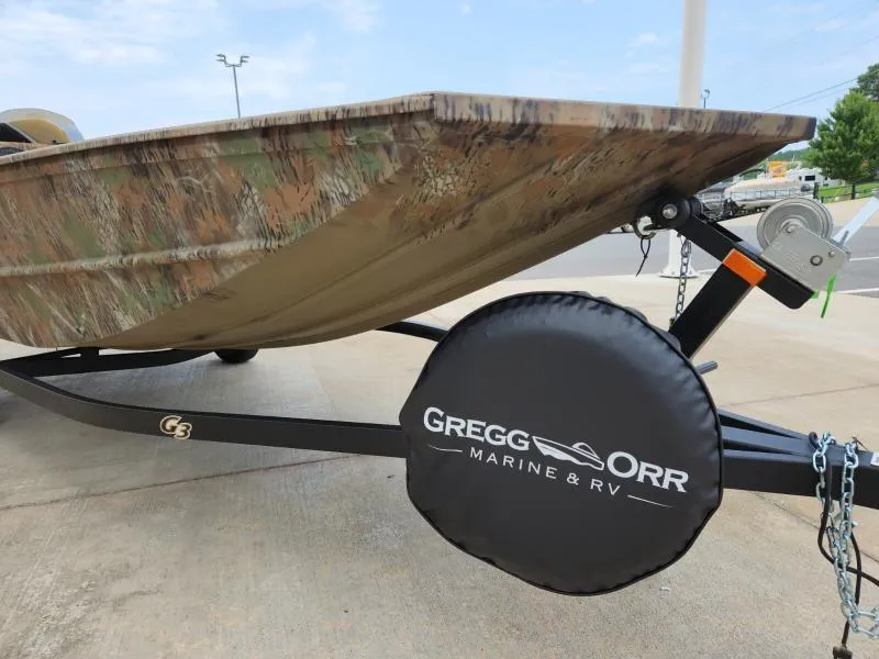 Slide: The Image of 2024 G3 17 SC boat on trailer, camo design, Gregg Orr Marine & RV cover. - 5