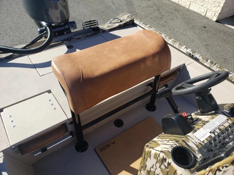 Slide: The Image of 2024 Avid Rogue 20 CC boat interior with tan seat and steering console. - 14