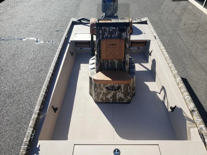 Slide: The Image of 2024 Avid Rogue 20 CC boat interior with camouflage design and central console. - 18