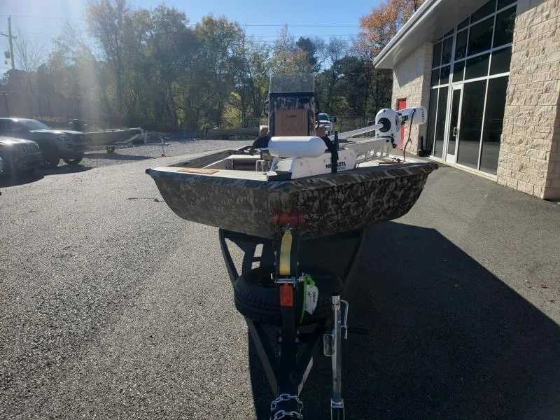 Slide: The Image of 2024 Avid Rogue 20 CC boat on trailer in outdoor setting. - 25