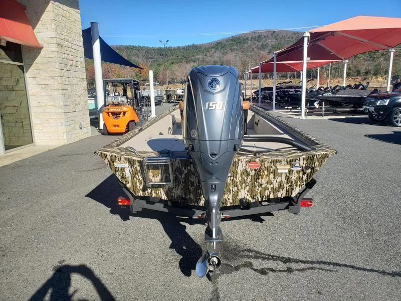 Slide: The Image of 2024 Avid Rogue 20 CC boat with camo design and 150 HP outboard motor. - 5