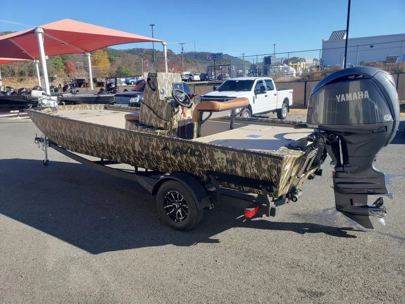 Slide: The Image of 2024 Avid Rogue 20 CC boat with Yamaha engine, parked outdoors. - 7